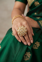 Royal Kundan ring with pearl string.