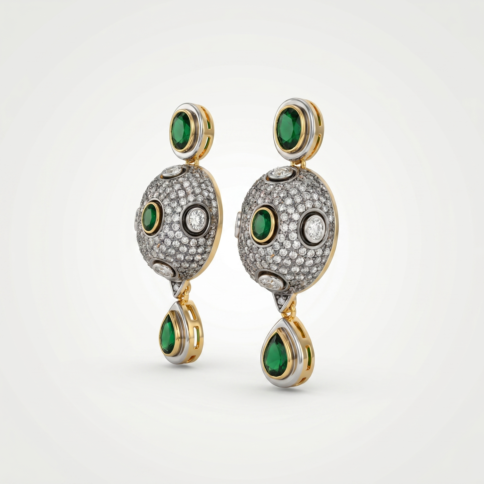 Pair of earrings with green gemstones and gold accents on a white background